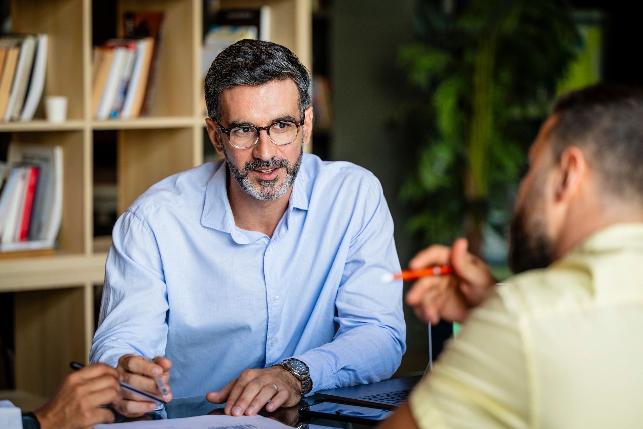 Business professional listening attentively during a meeting