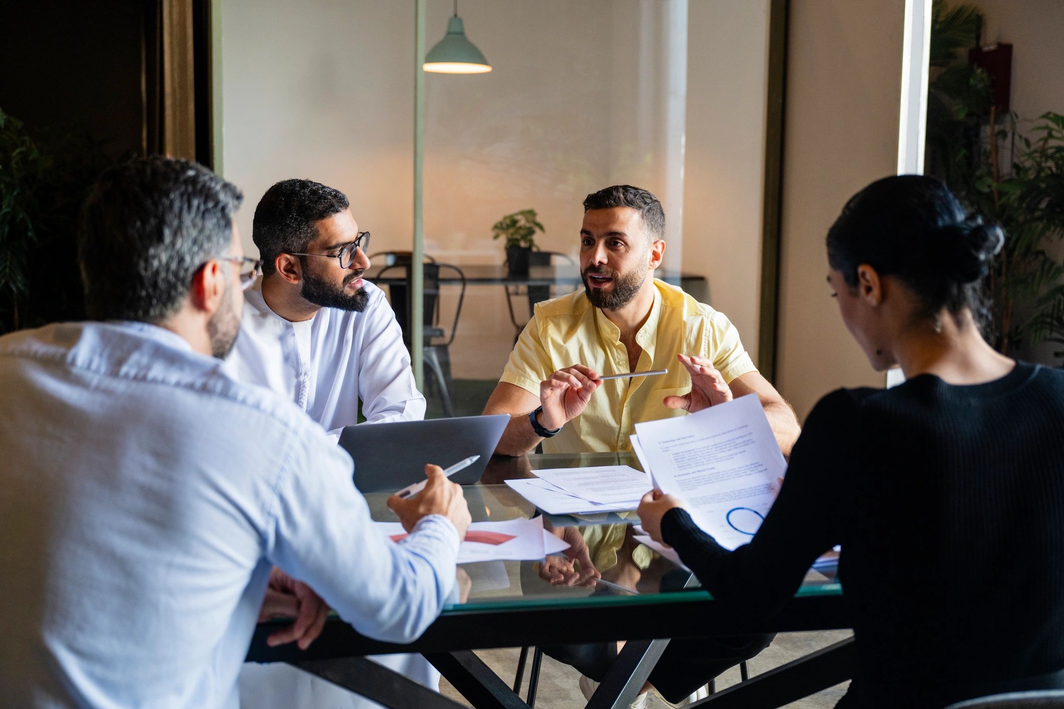 Consulting team discussing documents in a meeting