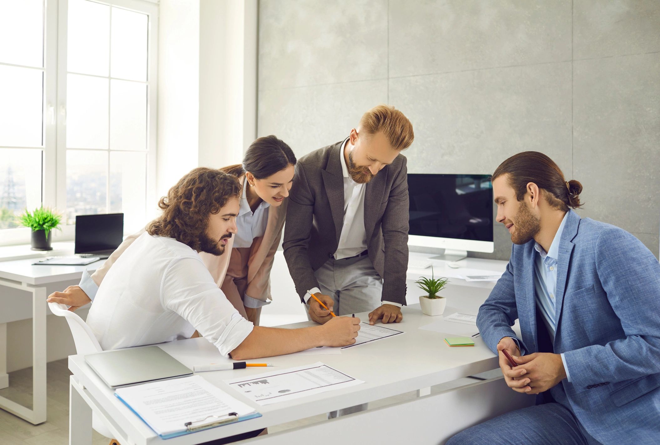 Diverse employees develop business project in office
