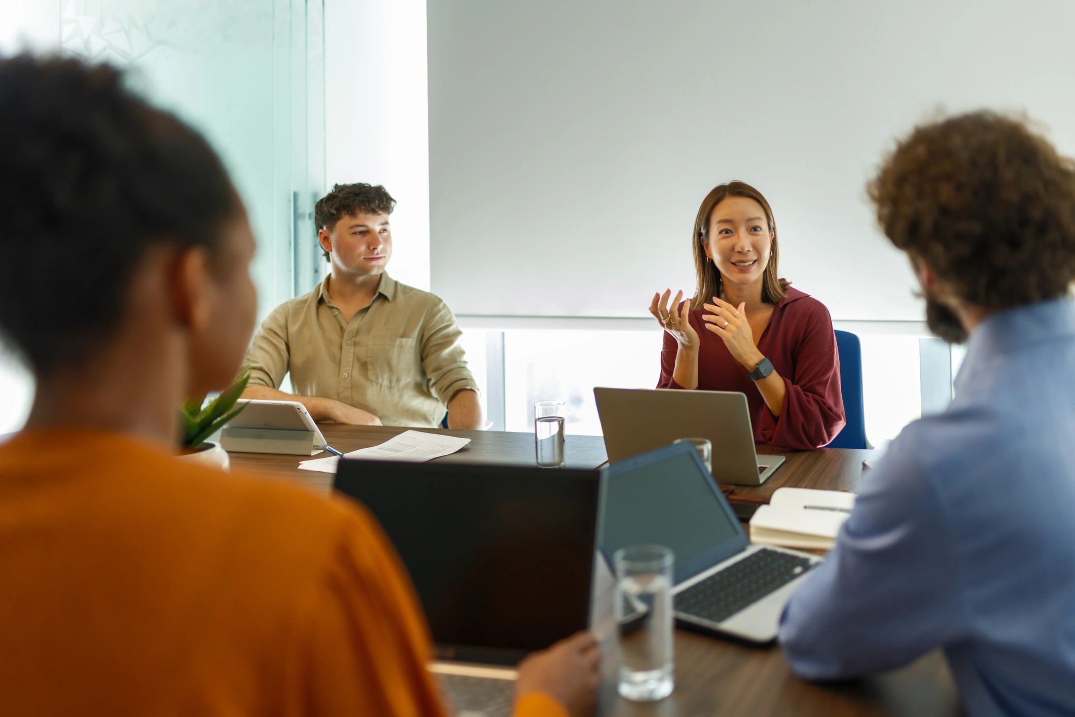 Cross-cultural team meeting in a modern office